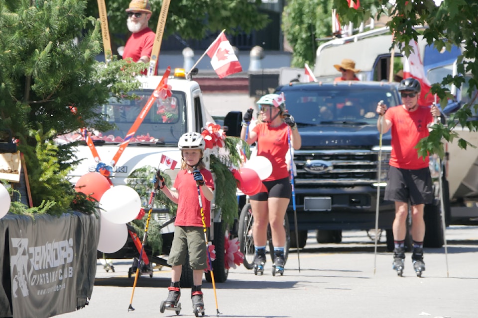 Members of the Revelstoke Nordic Ski Club parade down First Street West on Tuesday, July 1.