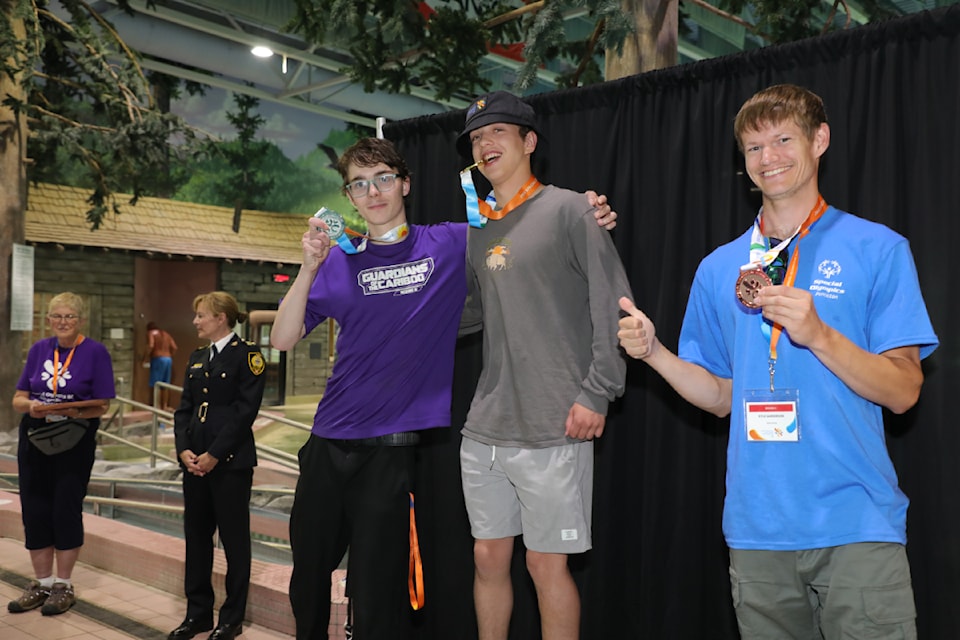 Revelstoke's Yorke Parkin, right from centre, receives a medal at the Special Olympics BC Summer Games in Prince George on July 11 and 12.