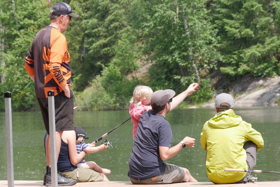 Families cast off and enjoy the water at Revelstoke's Williamson Lake for Father's Day on Sunday, June 15, an event hosted decades by the Revelstoke Rod & Gun Club.