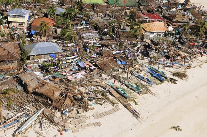 An aerial view shows damaged houses on a coastal community, after Typhoon Haiyan hit Iloilo Province