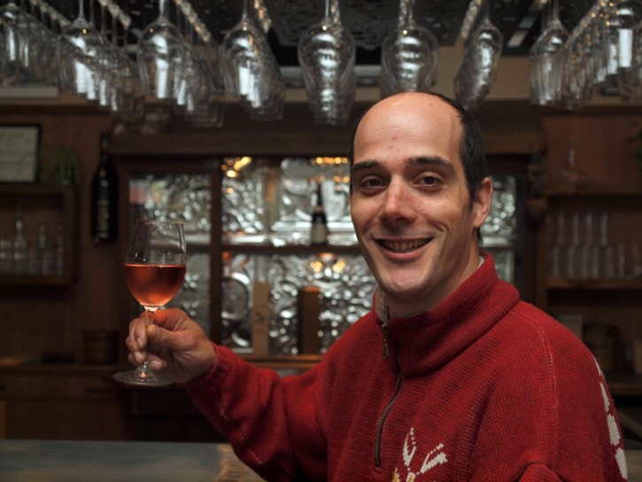 Benoit Doucet relaxes with a glass of rosee.