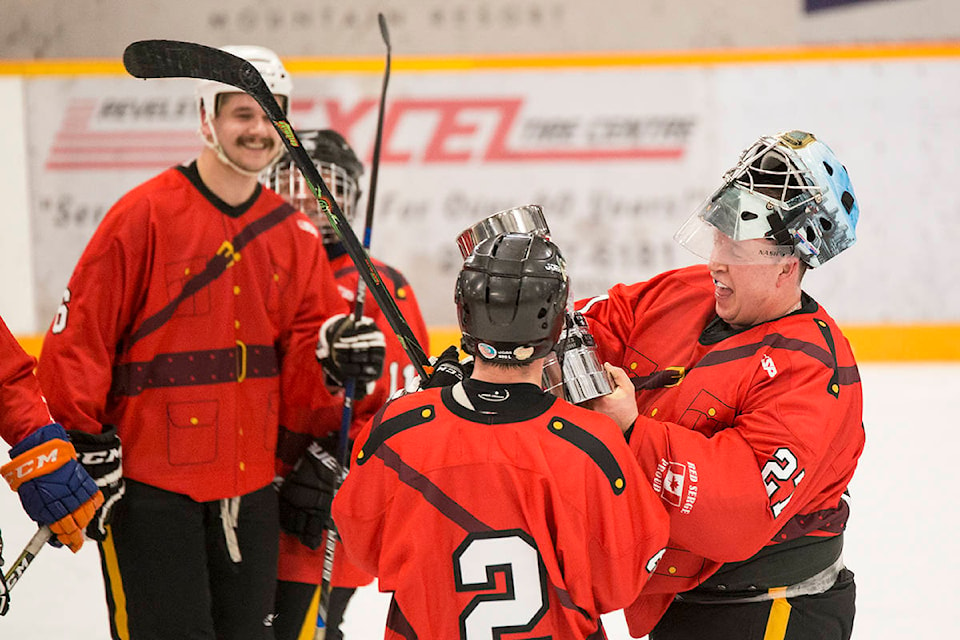 The RCMP won the annual show down against the firefighters 12-11 on Friday night at the Forum. All money raised at the event went to the BC Burn Fund, Muscular Dystrophy Canada and Tree’s for Tots. (Jocelyn Doll/Revelstoke Review)