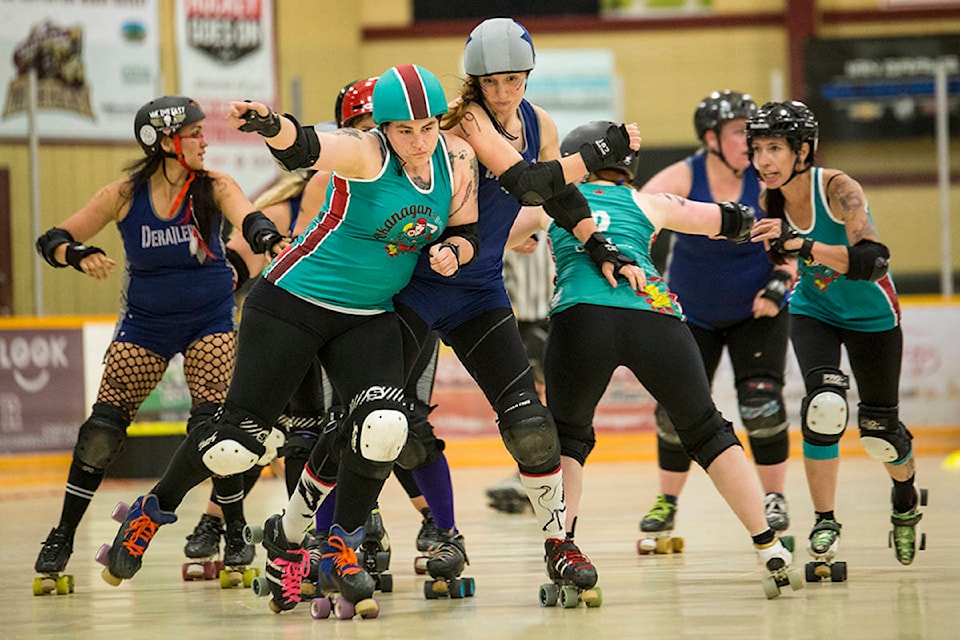 The Revelstoke Derailers took on Okanagan Roller Derby on Saturday night in their first bout of the season. Here, Rein of Pain tries to get past an Okangan Blocker and score some points for Revelstoke. (Jocelyn Doll/Revelstoke Review)