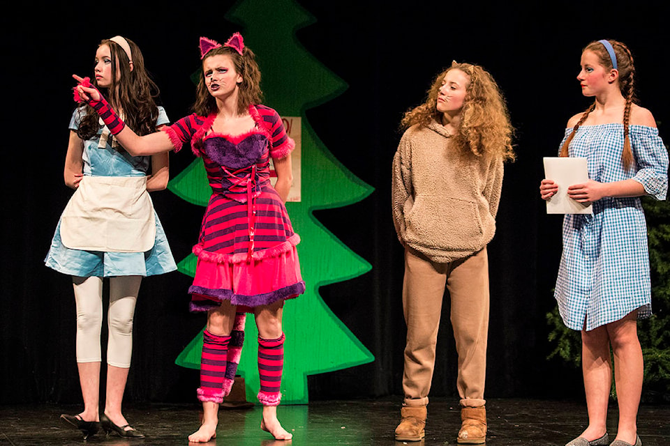 Josie McQuarrie played Alice, Olive Slager played the Cheshire Cat, Ruby Serrouya played the Lion and Rebecca Grabinsky played Dorothy in Revelstoke Secondary School’s production of Dorothy in Wonderland. (Jocelyn Doll/Revelstoke Review)