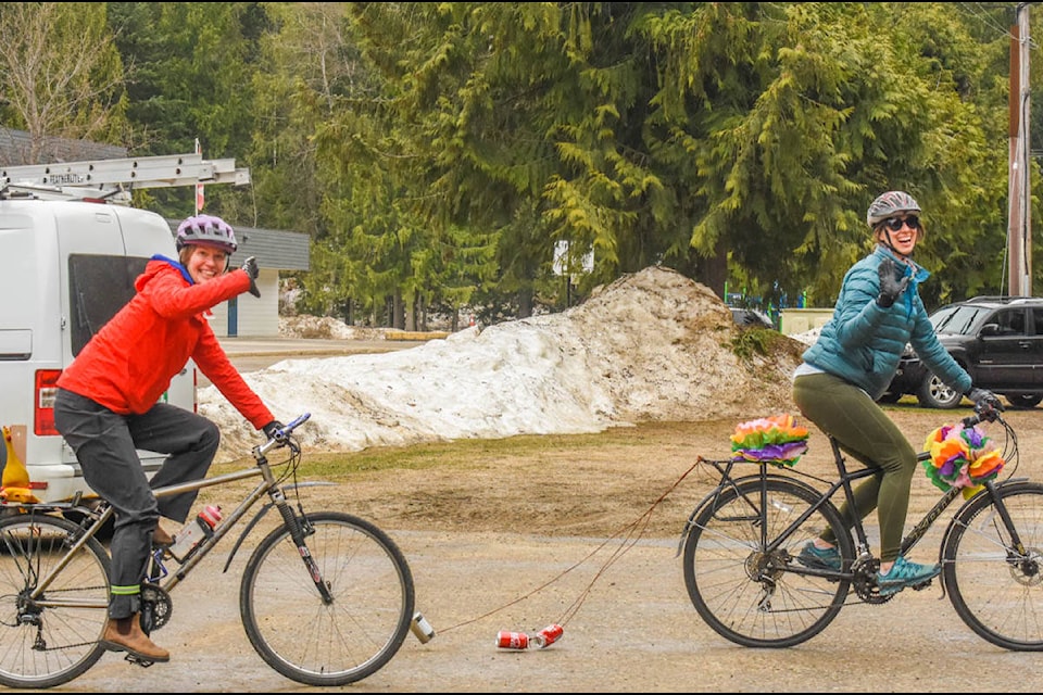 Arrow Heights Elementary school staff held a parade for their students April 14. Tare Johnson (left) and Jackie Uremovich took to their bikes. (Liam Harrap/Revelstoke Review)