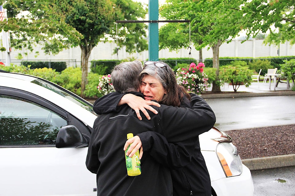 Natalie White embraces Johnny Forrest. White’s son Andrew Futerko was killed when his motorcycle collided with Forrest’s SUV late in the evening of June 20, 2018. White always had questions about the accident and wanted to meet with Forrest to talk about what happened that night. (Photo: Malin Jordan)