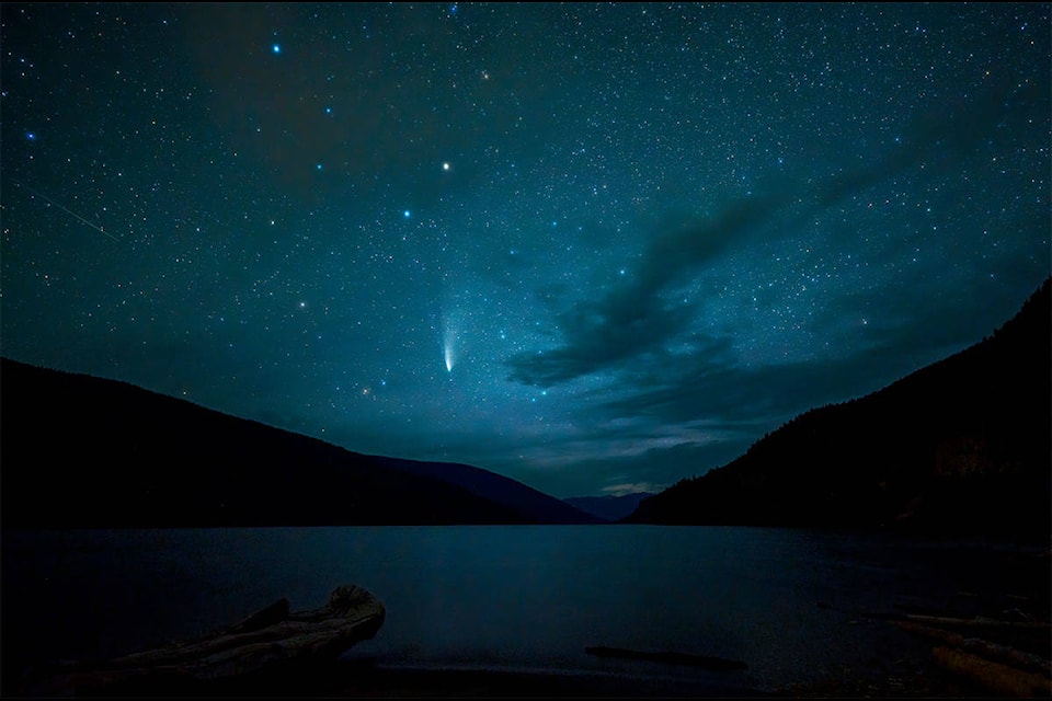 Comet NEOWISE above Revelstoke Lake, near the dam on Highway 23N. (Photo by Derek Potter)