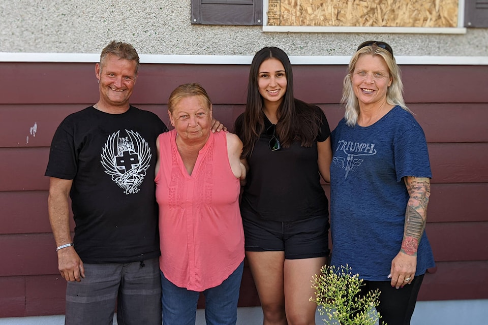 Penticton resident Linda Paksec (centre left) lost everything in a March house fire. Three strangers have since come together to help Paksec piece her life back together. (Jesse Day - Western News)