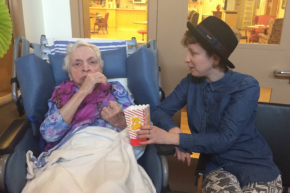 Theresa Hamilton visits a resident at Mt. Cartier Court. (Contributed)