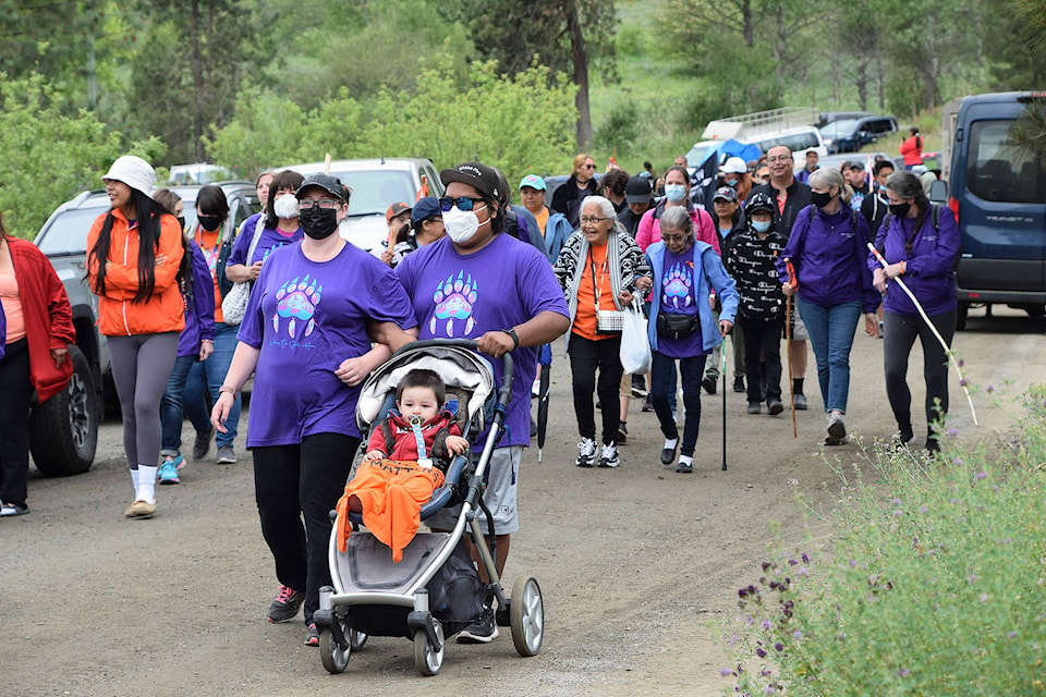 Hundreds of people, young and old, joined the three-day Walking Our Spirits Home procession, honouring residential school survivors, those who never made it home and all those affected by the institutions. Here people walk the third portion on June 13. (Martha Wickett - Salmon Arm Observer)