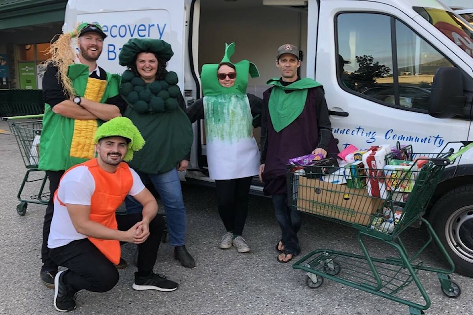 The team at the Revelstoke Review alongside Hannah Whitney and Andy Siegel volunteering at Save on Foods. (Contributed) The team at the Revelstoke Review alongside Hannah Whitney and Andy Siegel volunteering at Save on Foods. (Contributed)