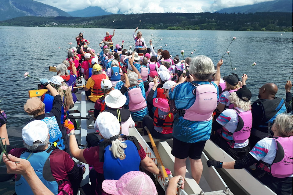 Dragon boaters gather in Salmon Arm June 18, 2022 to carry out the Carnation Ceremony honouring cancer survivors, supporters, those in remission, those living with cancer day-to-day and those who have died. (Photo contributed)