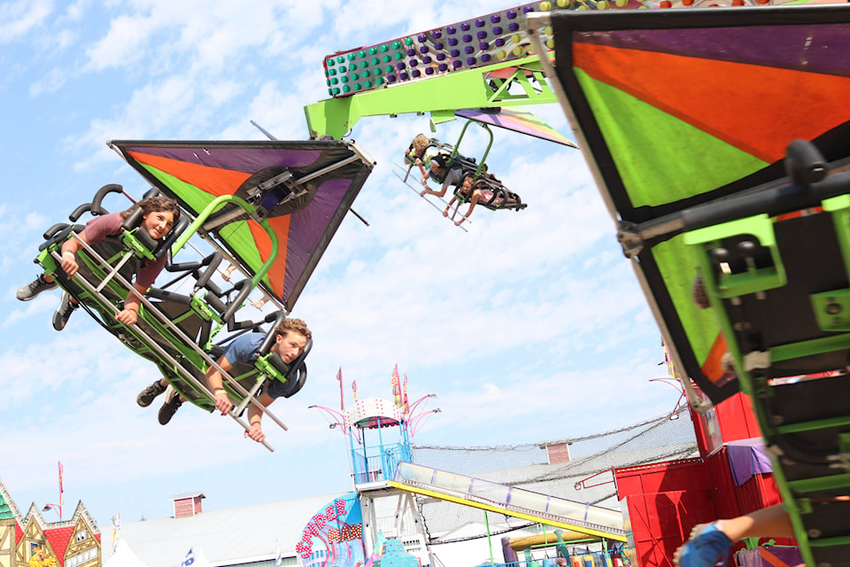 Thrills on the midway are just some of the excitements in store for fairgoers at the Interior Provincial Exhibition in Armstrong, which continues daily to Sunday, Sept. 4. Carter and Blake Charleton (right) enjoy a ride on the first day of the 121st fair Wednesday, Aug. 31. (Brendan Shykora - Morning Star)