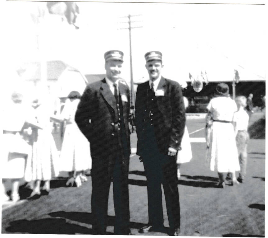 Benn Dean (left) and a colleague in uniform on the day of the Royal Trains arrival, July 1959. (Contributed by Dana Dean)
