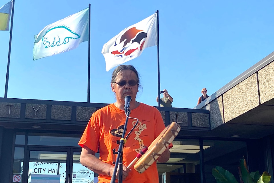 Shuswap member Randolph Sam sings and drums in front of Vernon city hall where two new flags were raised in honour of National Day of Truth and Reconciliation Friday, Sept. 30. (Jennifer Smith - Morning Star)