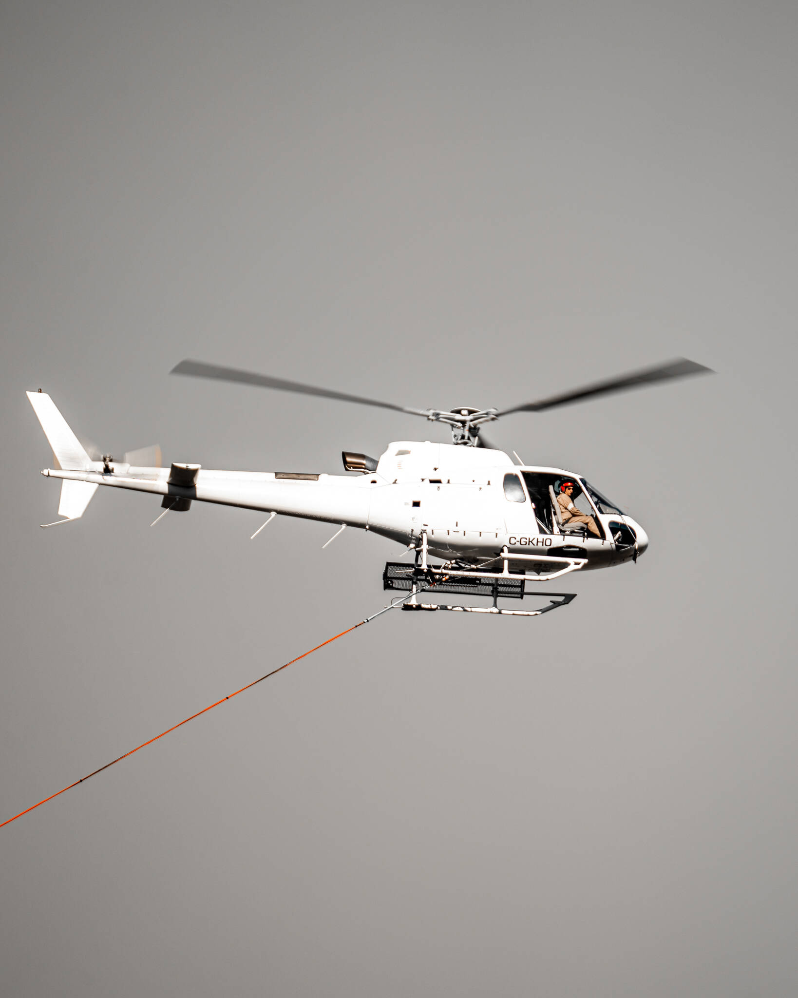 Helicopter prepares to water bomb a grassfire east of Grand Forks, B.C., on Oct. 10, 2022. (Tyler Takes Photos, contributed)