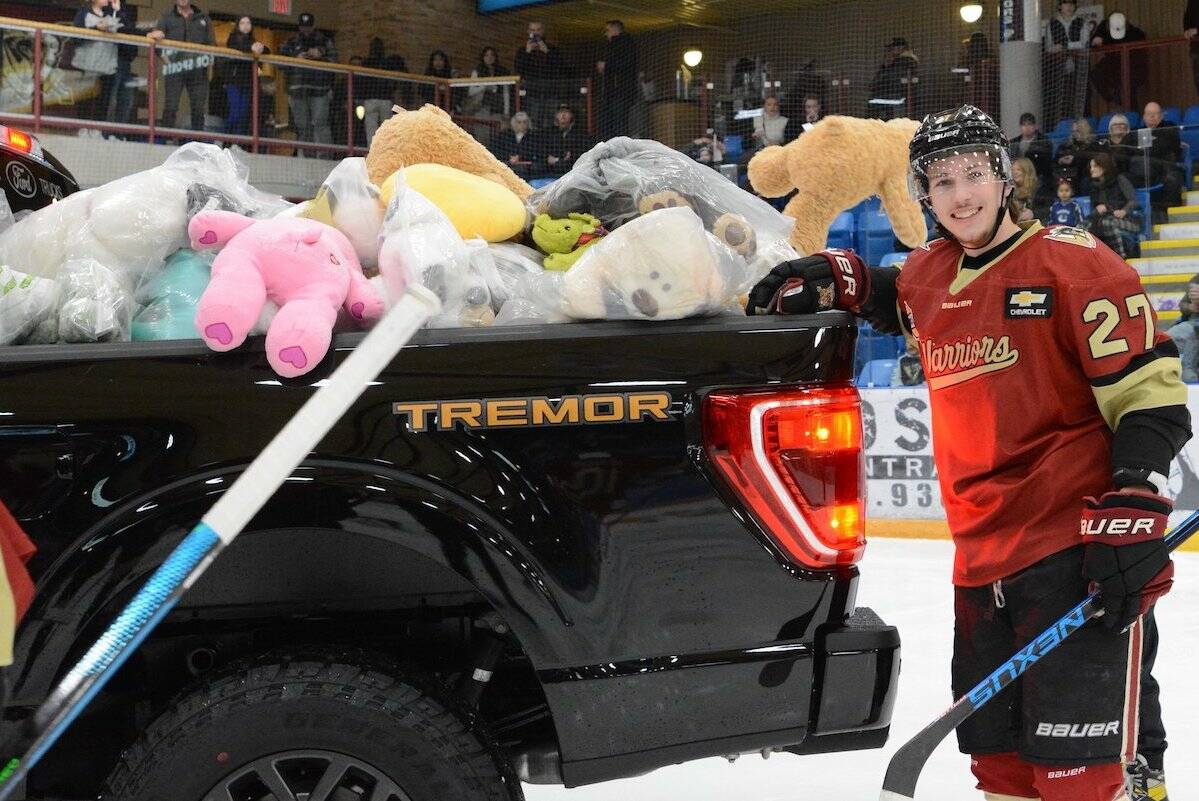 The West Kelowna Warriors pose for a photo after beating the Vernon Vipers on Teddy Bear Toss night at Royal LePage Place. (West Kelowna Warriors/Tami Quan Photography)