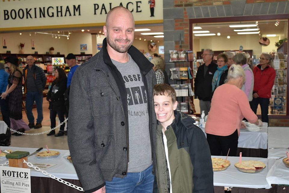 Josh Bickle and son Max bid $4,000 to the R.J. Haney Heritage Village and Museum and won a caramel apple pie. (Rebecca Willson- Salmon Arm Observer)