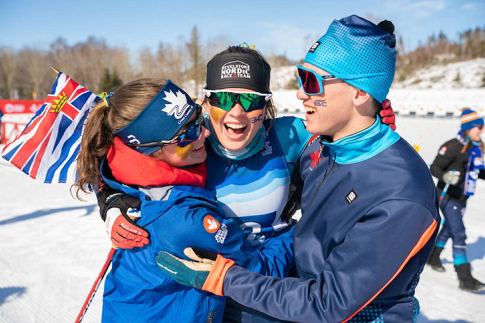 Marie Molinaro and Ian Mayer of Kelowna, celebrate with their relay ancho, Alexandra Luxmoore. (TeamBC)