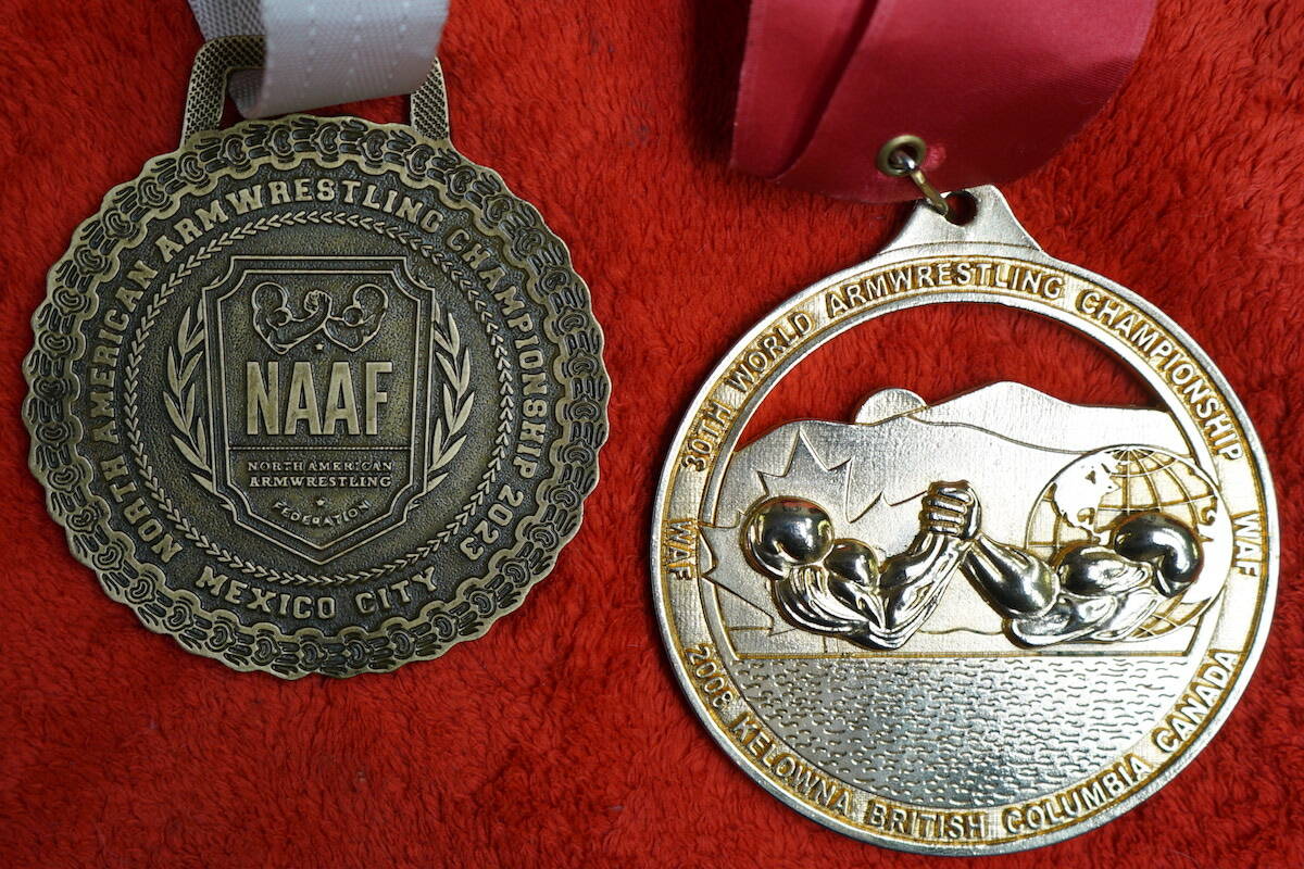 Gerry Beaudrys gold medals from the 2023 North American Armwrestling Championships held in Mexico City (left) and the 2008 World Armwrestling Championships held in Kelowna. (Photo/Gary Barens Capital News)