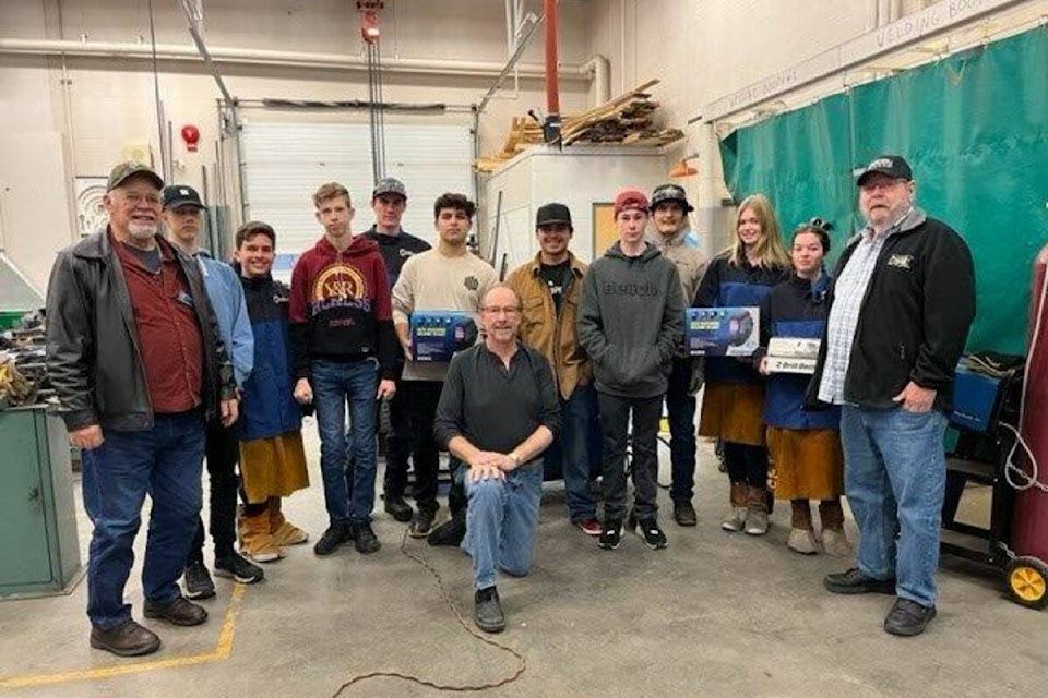 Charles Bloom students with their automobile gifts courtesy of the North Okanagan Vintage Car Club (Bowen Assman - Morning Star).