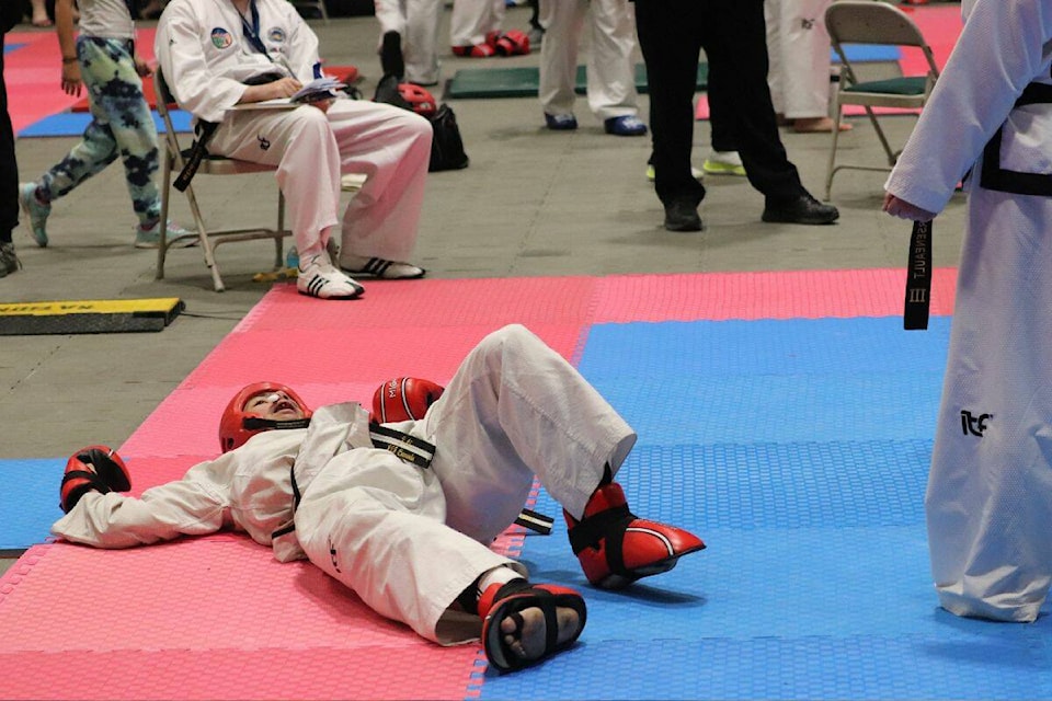 Jayden Li, a competitor with Vernon’s Sundance Martial Arts, gets dropped to the floor by Louis-Felix Masson from Quebec’s Tran Fusion Competition gym, during taekwondo action on Sunday, May 7 from Vernon’s Kal Tire Place (Bowen Assman-Morning Star photo).