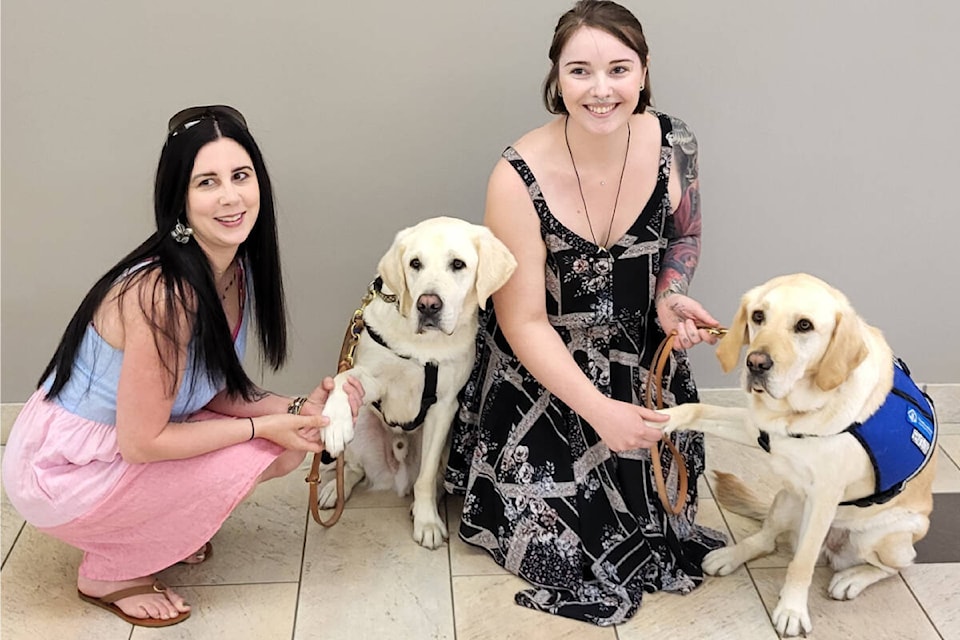 Kaleena Hammond (with Shay, from left), and Ashley Curwen, with Jovie, are grateful to the B.C. and Alberta Guide Dogs and Vernon Lions Club for the four-legged additions to their families. (Roger Knox - Morning Star)