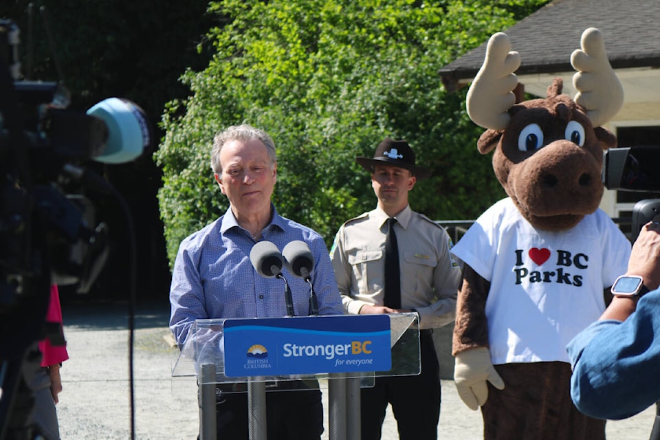 Provincial Environment Minister George Heyman announces $10 million in funding for the BC Parks Foundation outside Goldstream Nature House in Goldstream Provincial Park on June 1. (Bailey Moreton/News Staff)