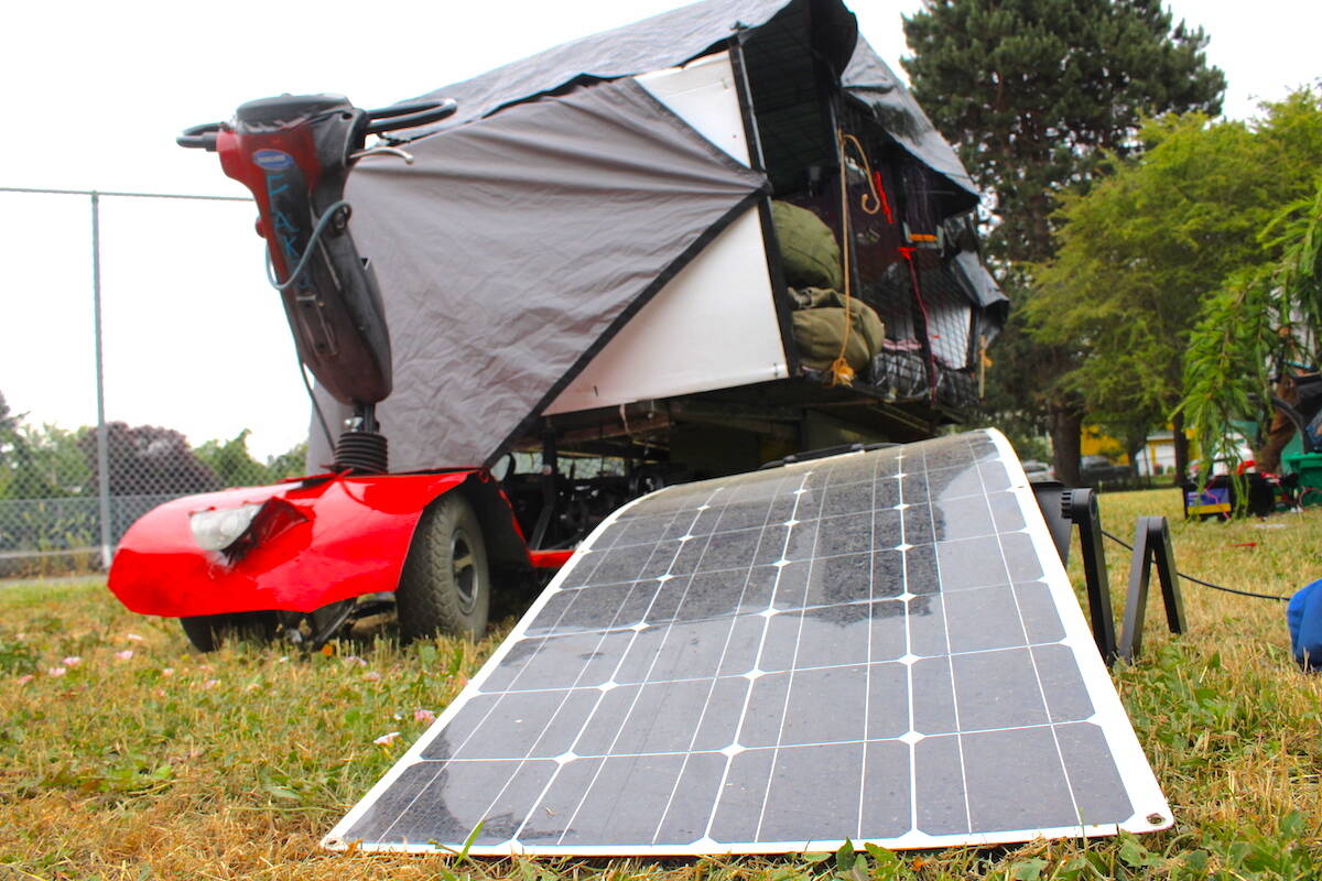 The solar-powered cart Cody (C.J.) Poole has been living in for months. He hopes to build versions of the carts for their homeless friends living with physical disabilities. (Jake Romphf/News Staff)