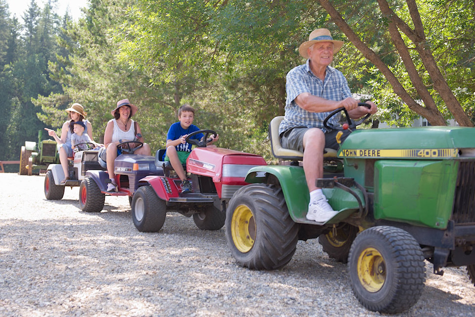 Guests receive a motorized tour of the grounds during the 60th anniversary celebration at R.J. Haney Heritage Village & Museum on Saturday, July 8, 2023. (Lachlan Labere-Salmon Arm Observer)
