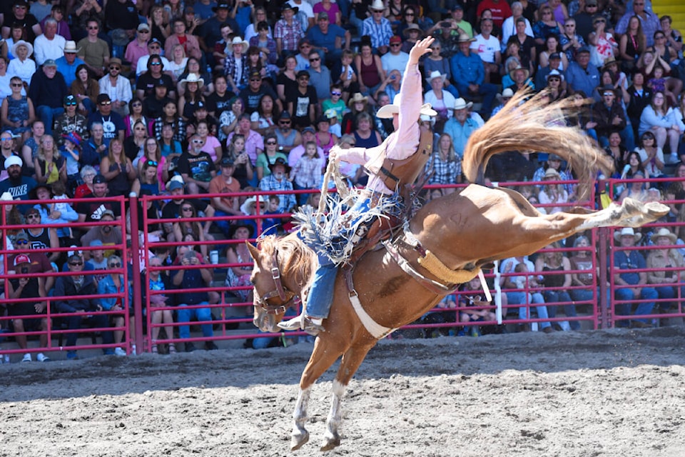 Armstrong cowboy Jaret Cooper, shown competing at the Williams Lake Stampede on the Canada Day long weekend, followed up a win in novice saddle bronc in the Laketown by finishing fourth at the legendary Calgary Stampede. Cooper was the defending event champion. (Angie Mindus - Black Press Media)