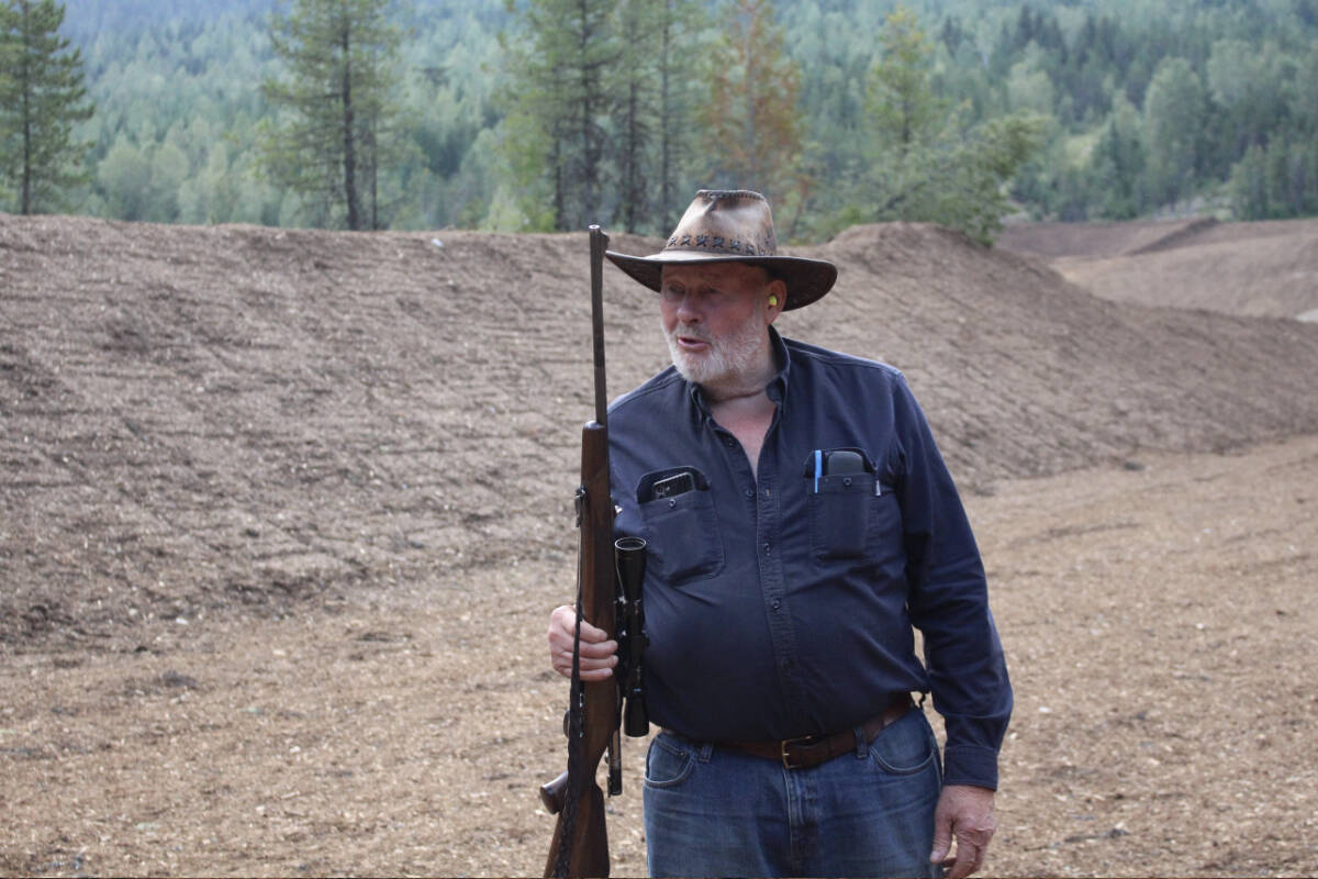 George Buhler firing the first shot on Aug. 2. (Josh Piercey/Revelstoke Review)