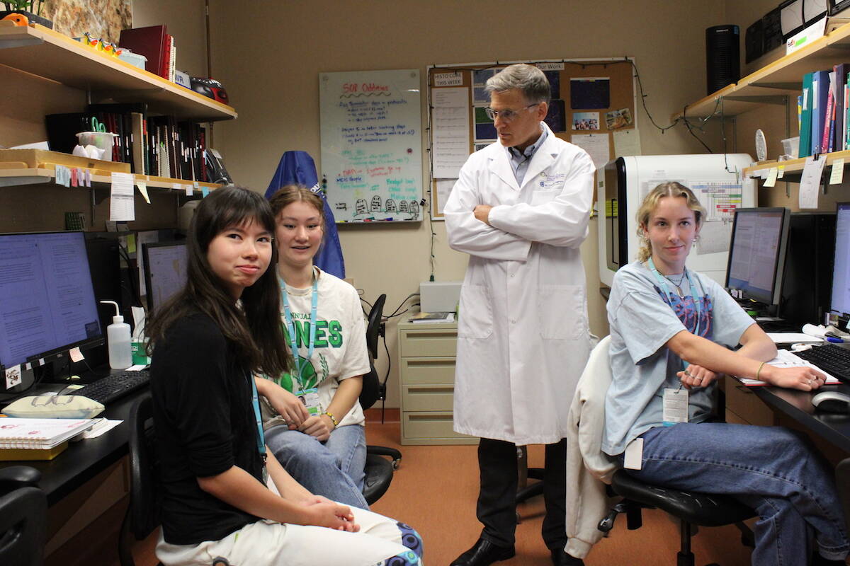Deeley Research Centre director Dr. Brad Nelson with summer students from local high schools and the University of Victoria on Aug. 23. (Jake Romphf/News Staff)