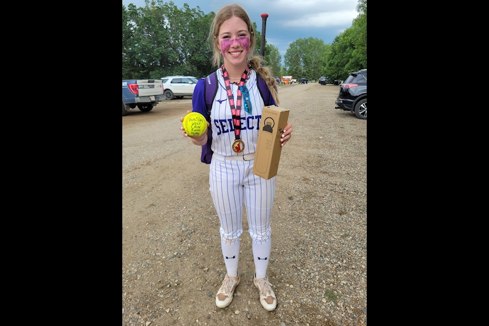 Kacey Beagle hits a home run at the Western Canadian Softball Championships. (Photo submitted)