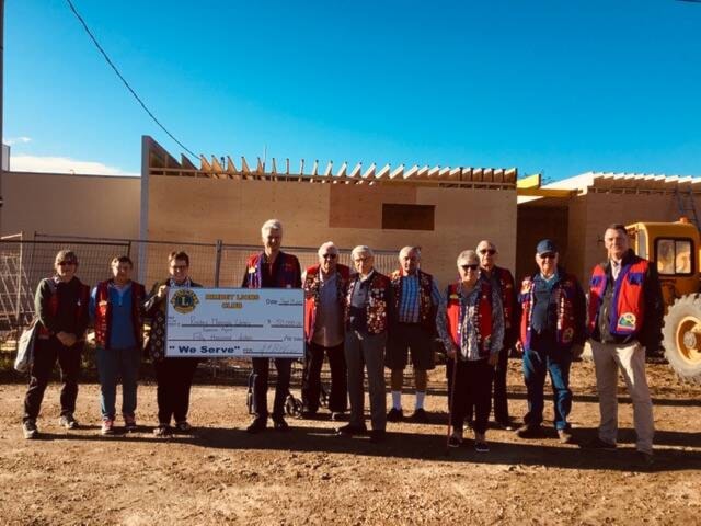 The Rimbey Lions Club donated their first installment of $50,000 to the Rimbey Municipal Library Expansion Project. The Rimbey Lions Club will donate a total of $100,000 towards the Rimbey Library Expansion in the months to come.	(Left to Right): Rimbey Lions Club members Susan Preston, Penny Waldron, Rimbey Town Councillor Lana Curle, Rimbey Lions Club President Steffen Olsen and Rimbey Lions Club members Howard Steele, Michael Jarmoluk, Dennis Oelhaupl, Eileen Poulsen, Gene Chopiuk, Ted Jamieson and Laverne Oberhammer. (Photo submitted)