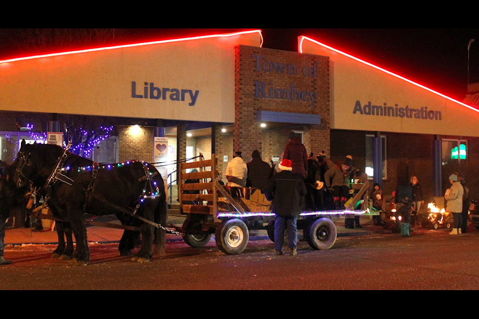 Rimbey residents were treated to a carolers on a horse drawn wagon while enjoying late night shopping, hot dogs, hot chocolate and a visit from Santa himself during the Rimbey Holiday Twilight Shop on Dec. 2, 2021. (Christi Albers-Manicke/RIMBEY REVIEW)