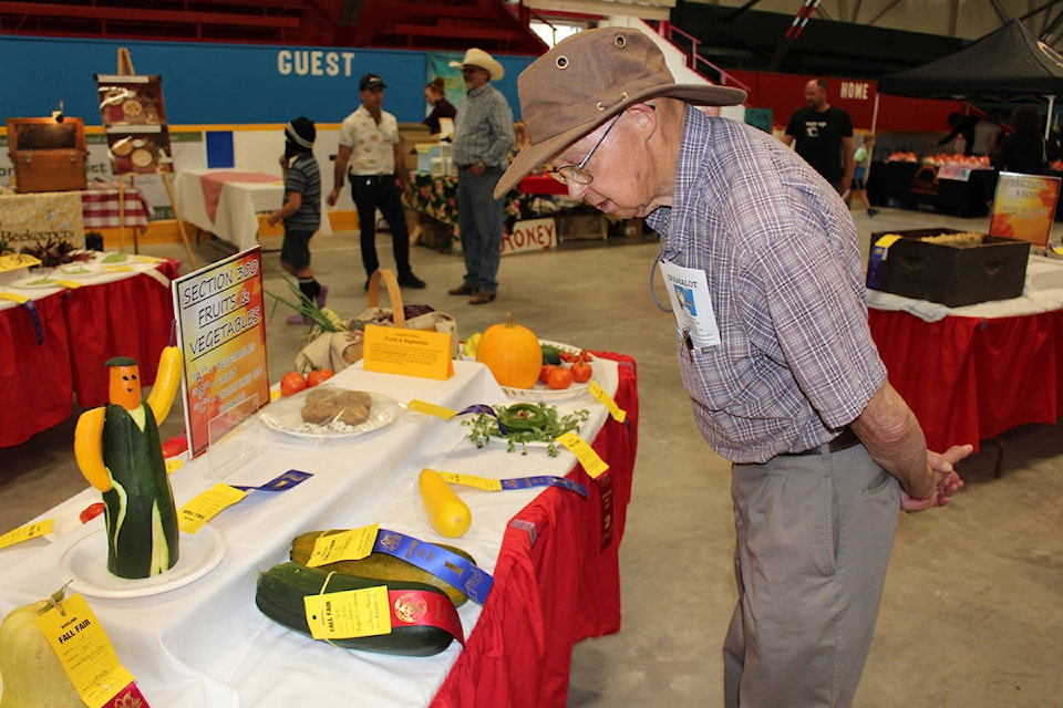 Reviewing the produce winners at the Fall Fair (Photo by John Boivin)