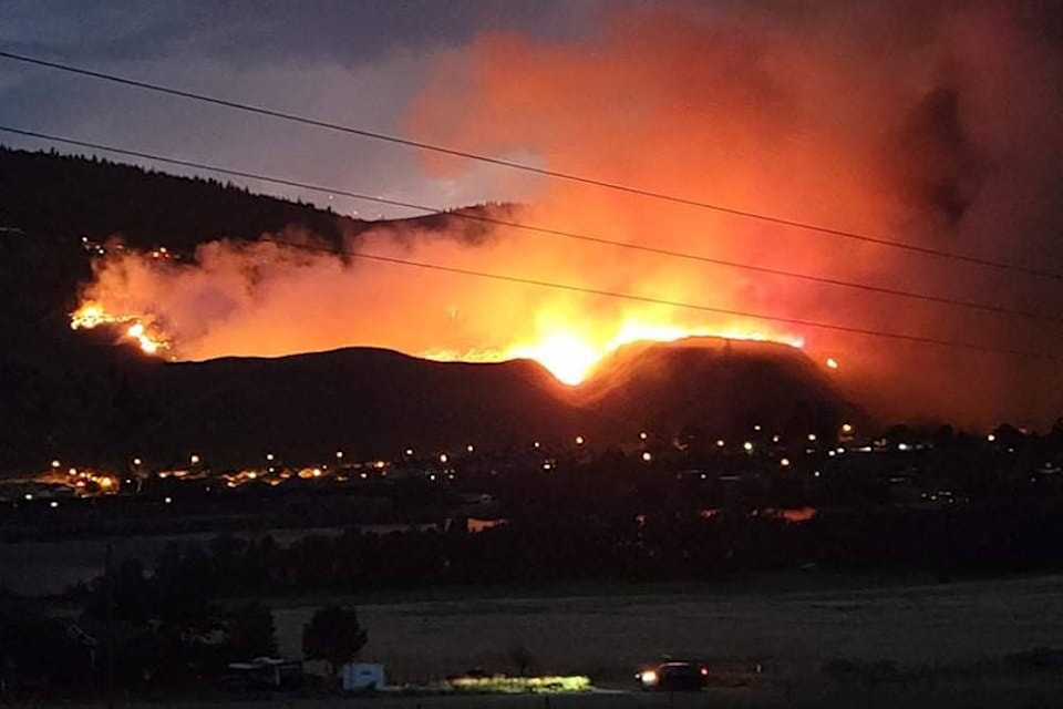 A lightning-caused wildfire in Kamloops’ Juniper Ridge neighbourhood on July 1, 2021. (@sarah_sandholm/Twitter)A lightning-caused wildfire in Kamloops’ Juniper Ridge neighbourhood on July 1, 2021. (@sarah_sandholm/Twitter)