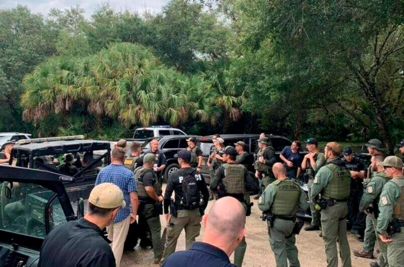 This photo provided by North Port Police Department, law enforcement officials conduct a search of the vast Carlton Reserve in the Sarasota, Fla., area for Brian Laundrie on Saturday, Sept. 18, 2021. Laundrie is a person of interest in the disappearance of his girlfriend, Gabrielle “Gabby” Petito. (North Port Police Department via AP)