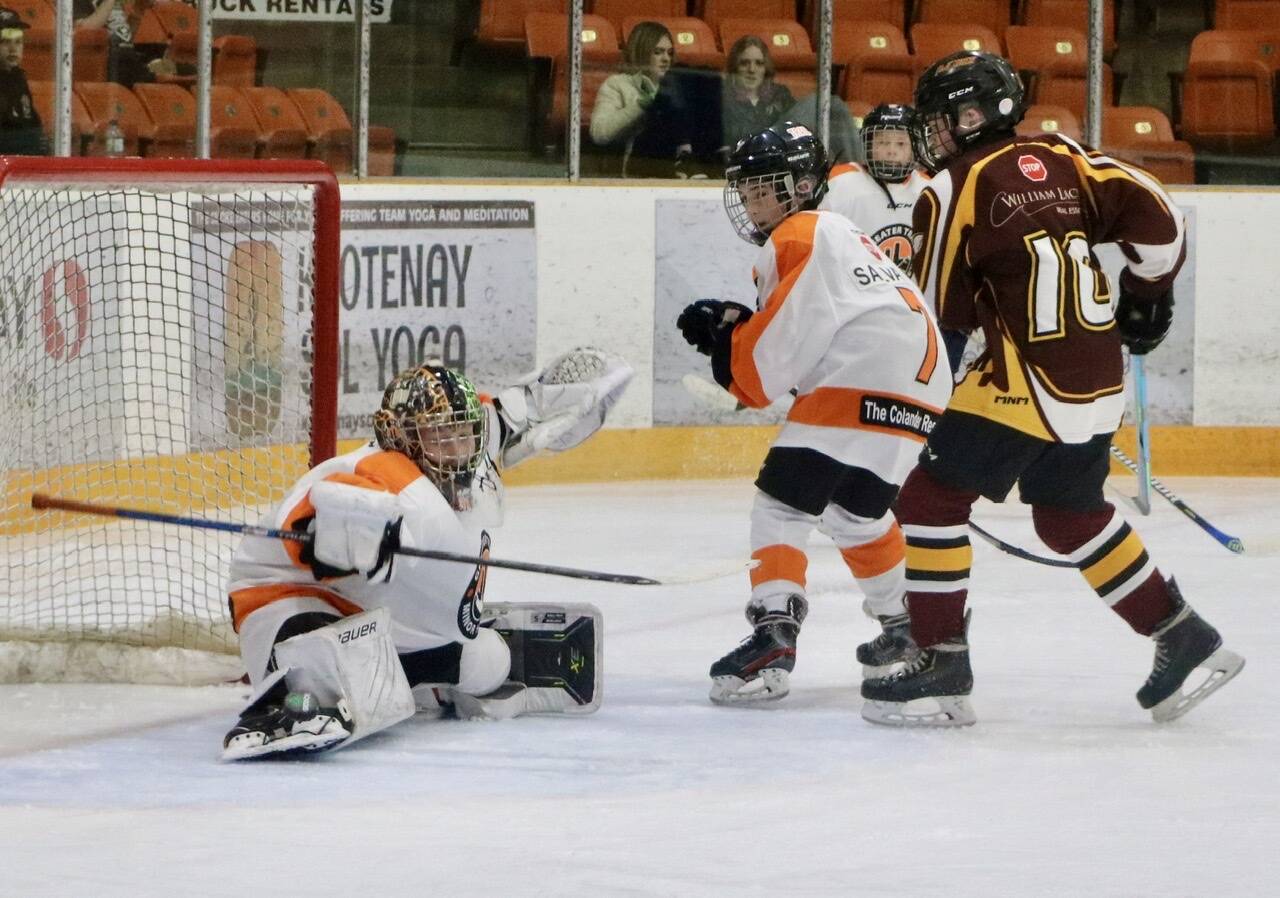 Trail goalie Hudson Swankhuizen makes one of several big stops in his first shutout of the tournament. Photo: Jim Bailey