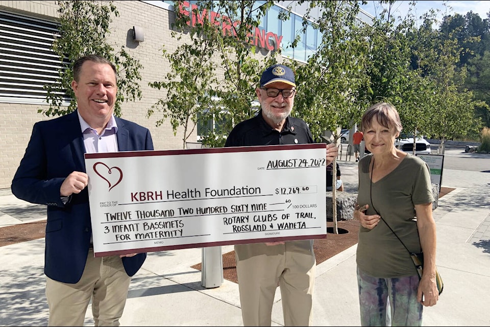 L-R: Paul Butler, Foundation Board Member, accepts this donation from Richard Fish, Trail Rotary President, and Maddie Harlemovs, Waneta Rotary Secretary. Photo: Submitted