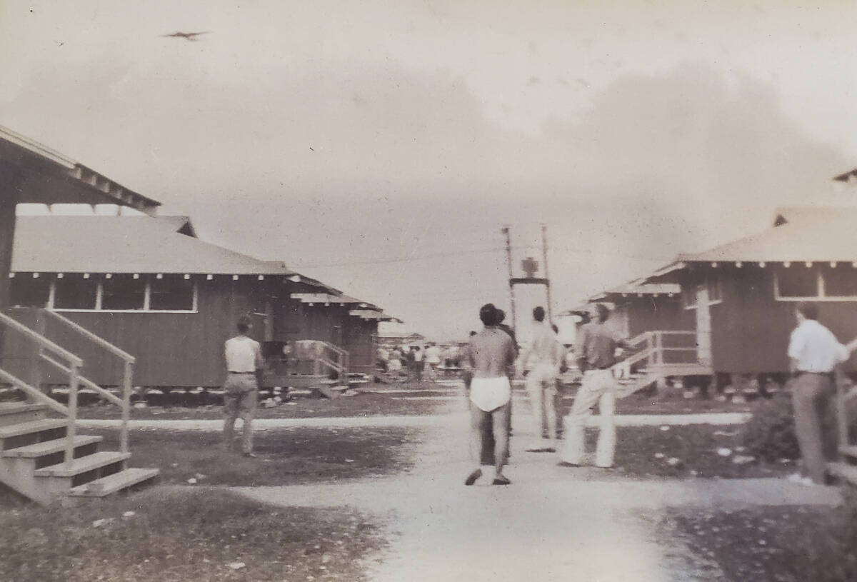 Men run out of the barracks to witness the bombing of nearby battleships at Pearl Harbour. (Joe Fetters photo)
