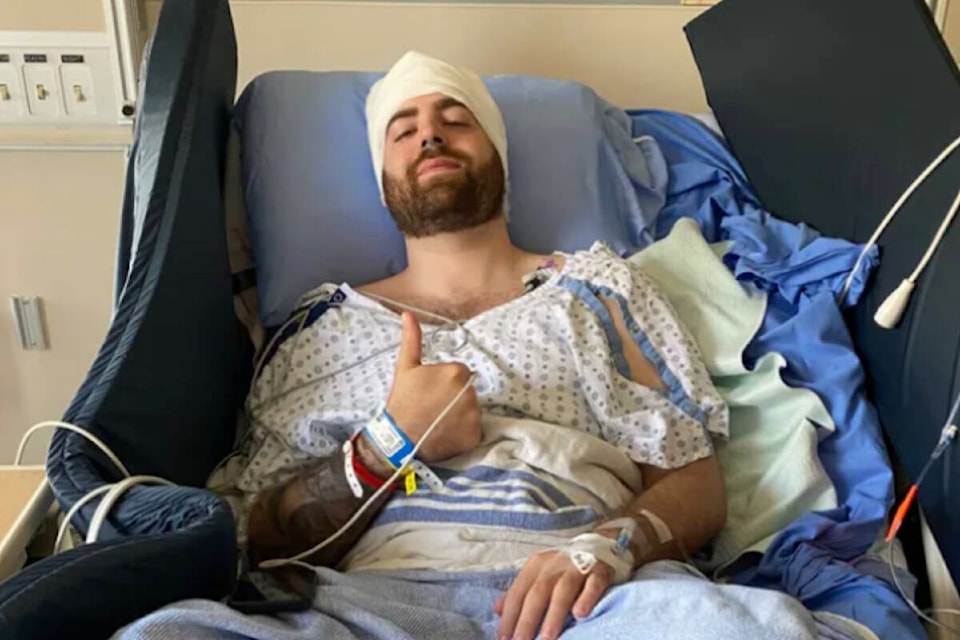 Daniel DelBianco gives a thumbs up from his hospital bed after a round of surgery. Photo: Submitted