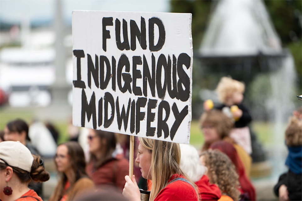 Community members rallied outside the B.C. legislature on June 26, calling for SIIMS funding to be restored.