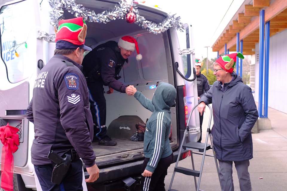 Saanich Police and Colquitz Middle School students teamed up on Dec. 12 to collect donations for families in need during the 11th Cram the Cruiser event.