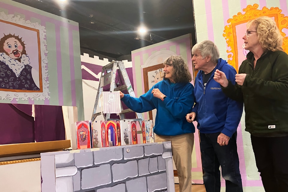 Set designer Helena Hitchcock, left, husband and set build lead David Hitchcock and panto director Heather Lee check out the set design ahead of St. Luke's Players' presentation of Camelot that hits the stage Dec. 12 to 30.