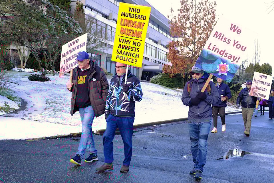 Dozens marched from Saanich Municipal Hall to B.C.’s Legislature on Feb. 2, 2025, led by Jeffrey Buziak (middle), seeking justice for his daughter, Lindsay Buziak. On this day, 17 years ago, Buziak was stabbed more than 40 times. Her case remains unsolved. 