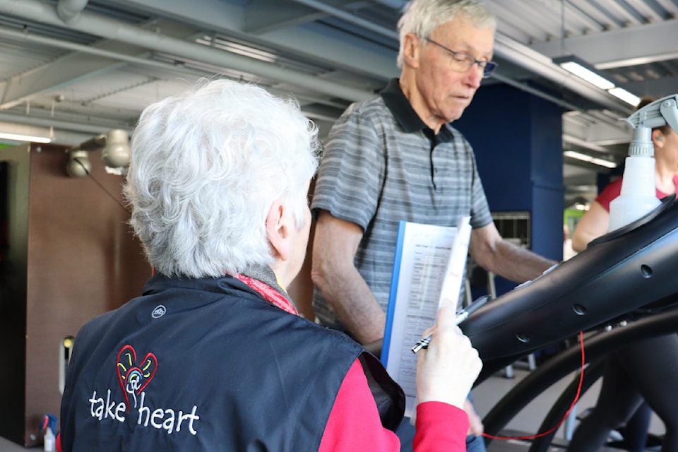 Take Heart program participant Dennis Watts receives guidance from registered nurse Sandy Gilmour, clinical lead for the program.