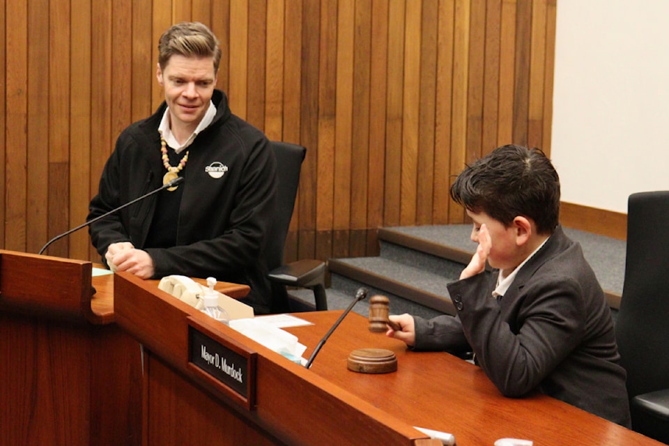 Mayor Dean Murdock presents the ‘candy key to the district’ to Weston Taiji.