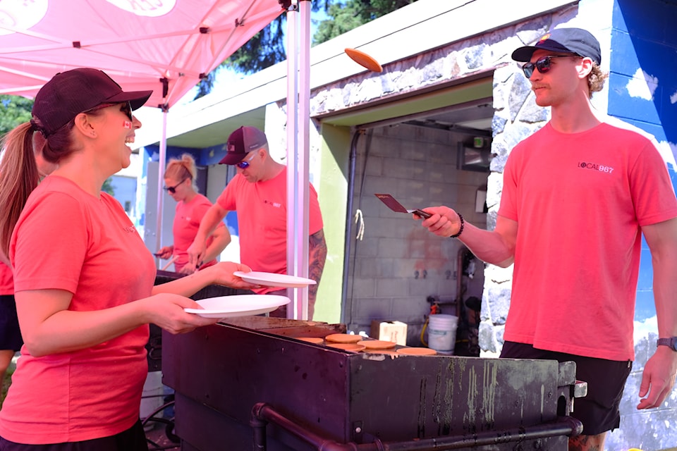 Jack from Saanich Fire showcases his pancake-flipping skills. 